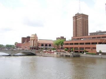 Aurora, IL - The Fox River and Galena Boulevard dam, Paramount Theatre, Aurora Riverwalk, Civic Center, and Leland Tower. Source: Wikipedia